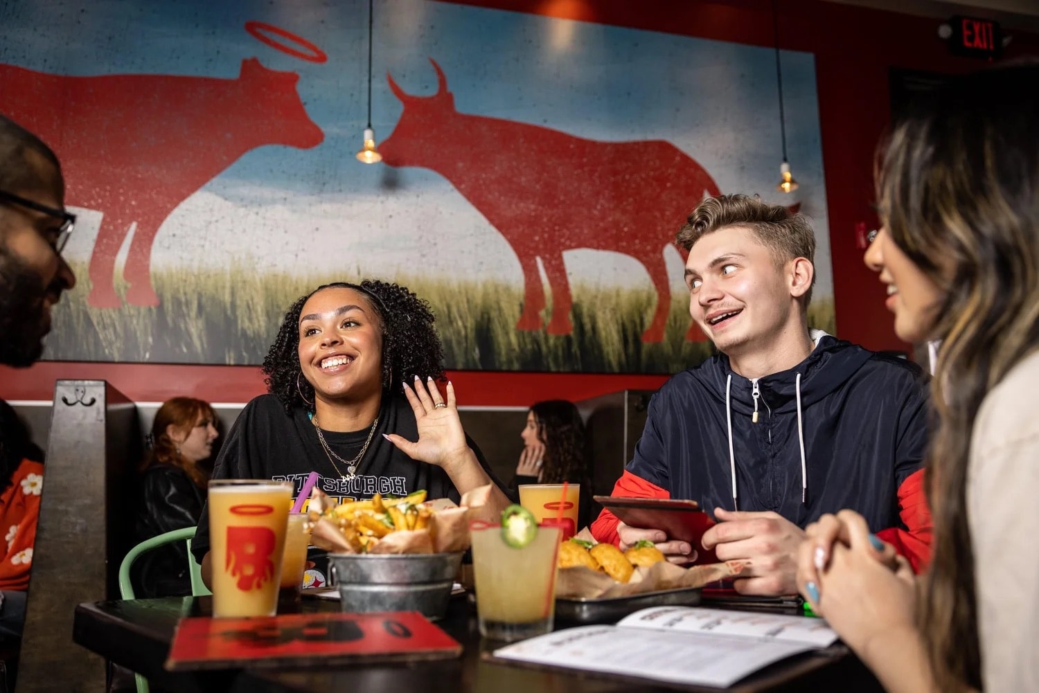 Friends dining at Burgatory — Pittsburgh burger scene