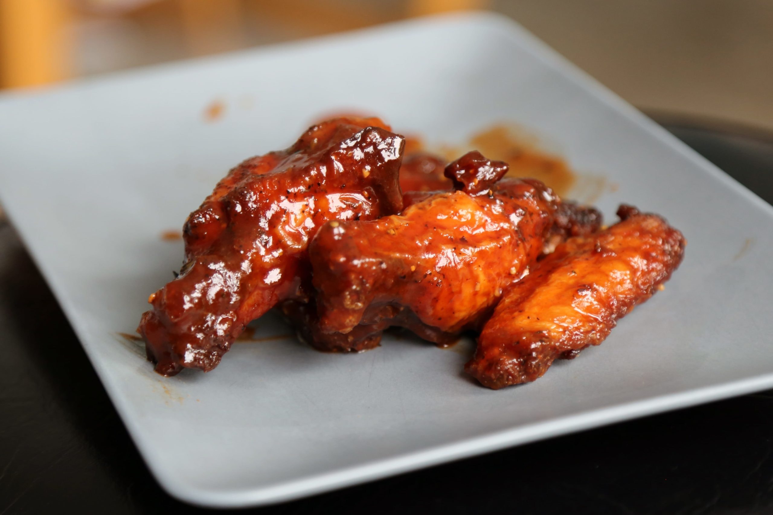 Glazed honey BBQ wings on a plate