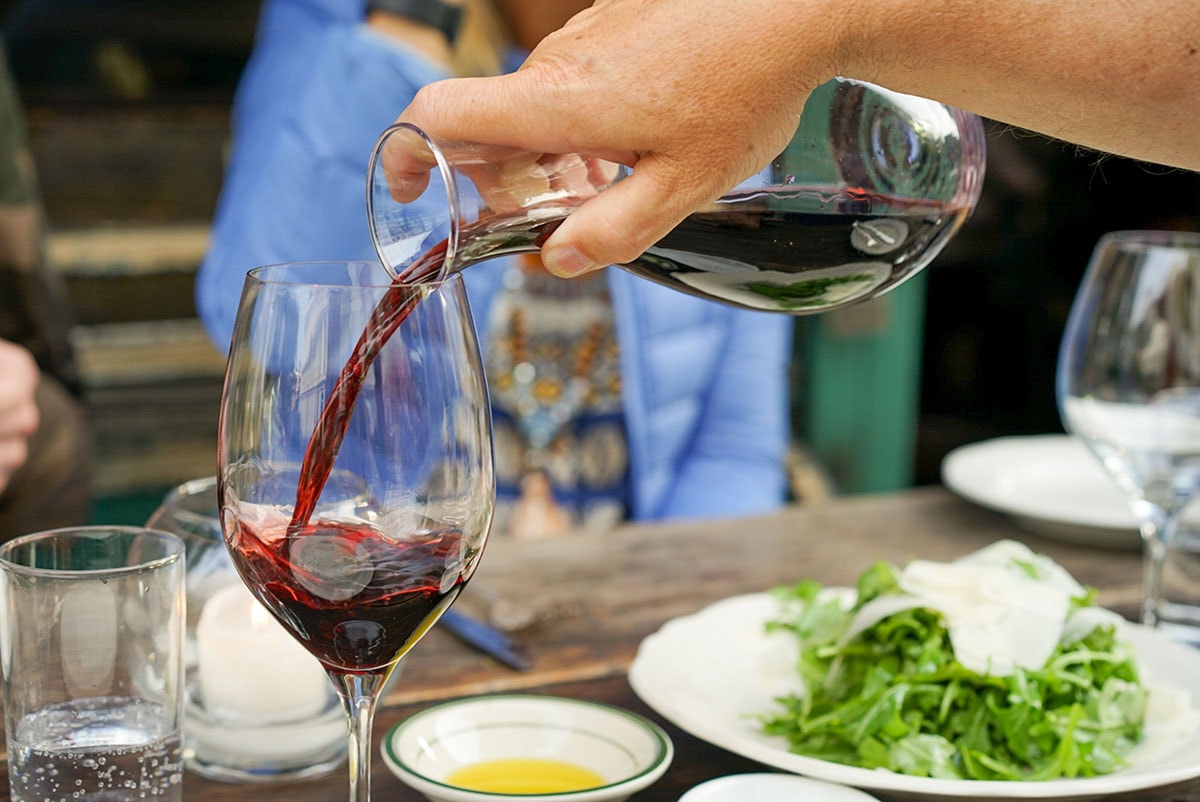 Red wine being poured at a Pittsburgh wine dinner