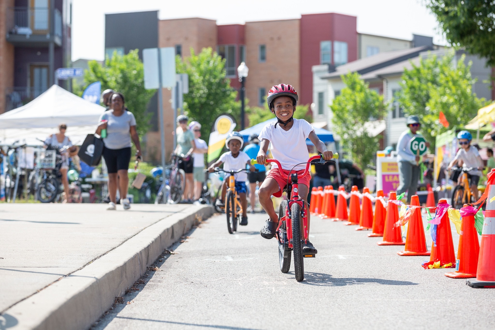 Family with bikes at OpenStreetsPGH — Pittsburgh streets go car-free July 26