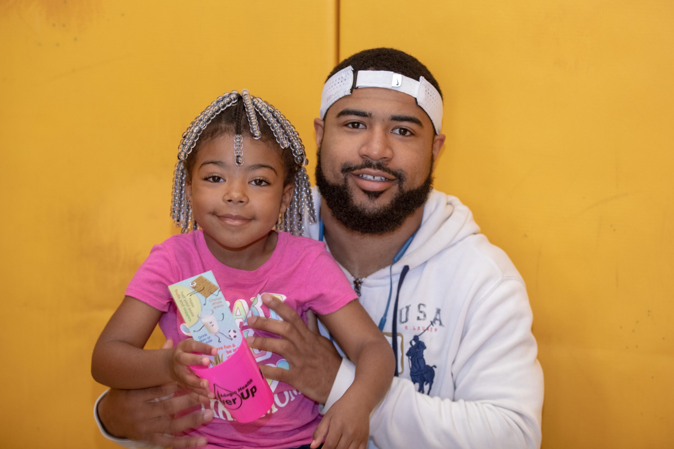Father and daughter at Homewood Children's Village community event
