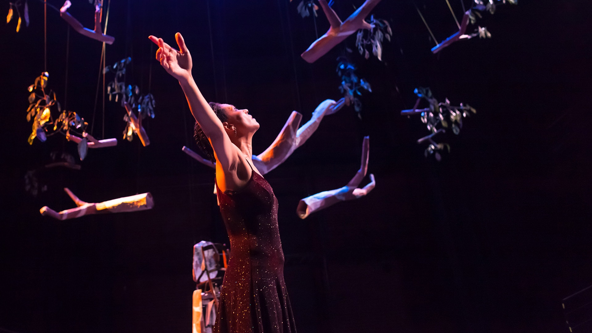 Performer with arms raised at New Hazlett Theater