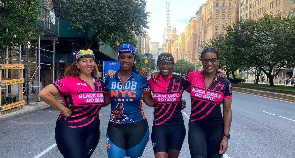 Black woman cyclist resting on her bike on a trail — Black Girls Do Bike