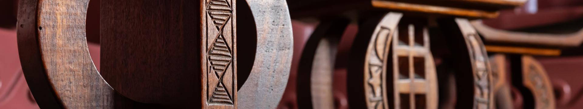 Close-up of carved wooden stool base in the African Heritage Classroom
