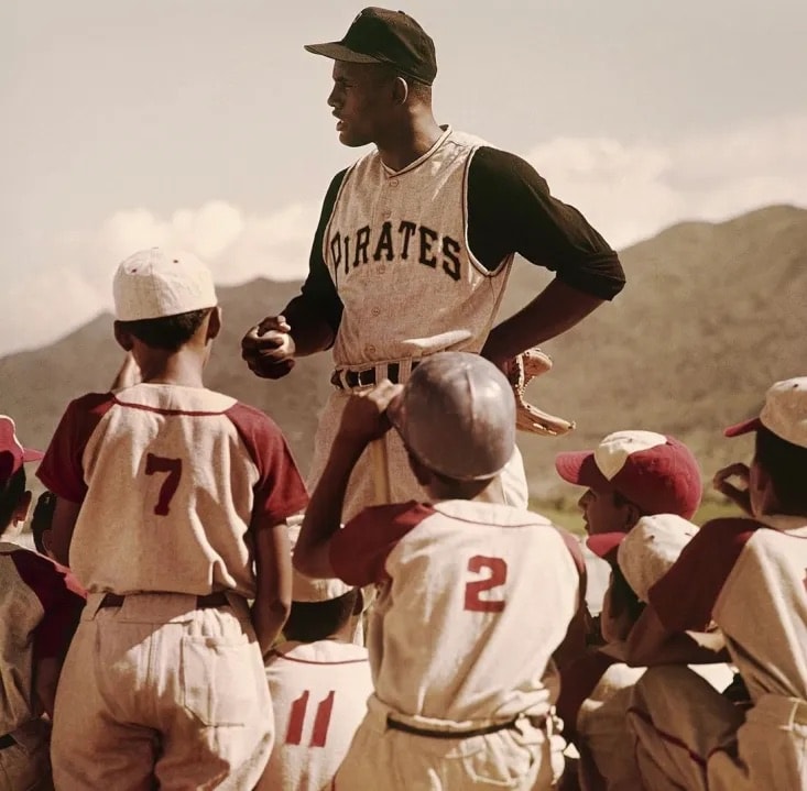 Roberto Clemente coaching youth baseball players in Puerto Rico