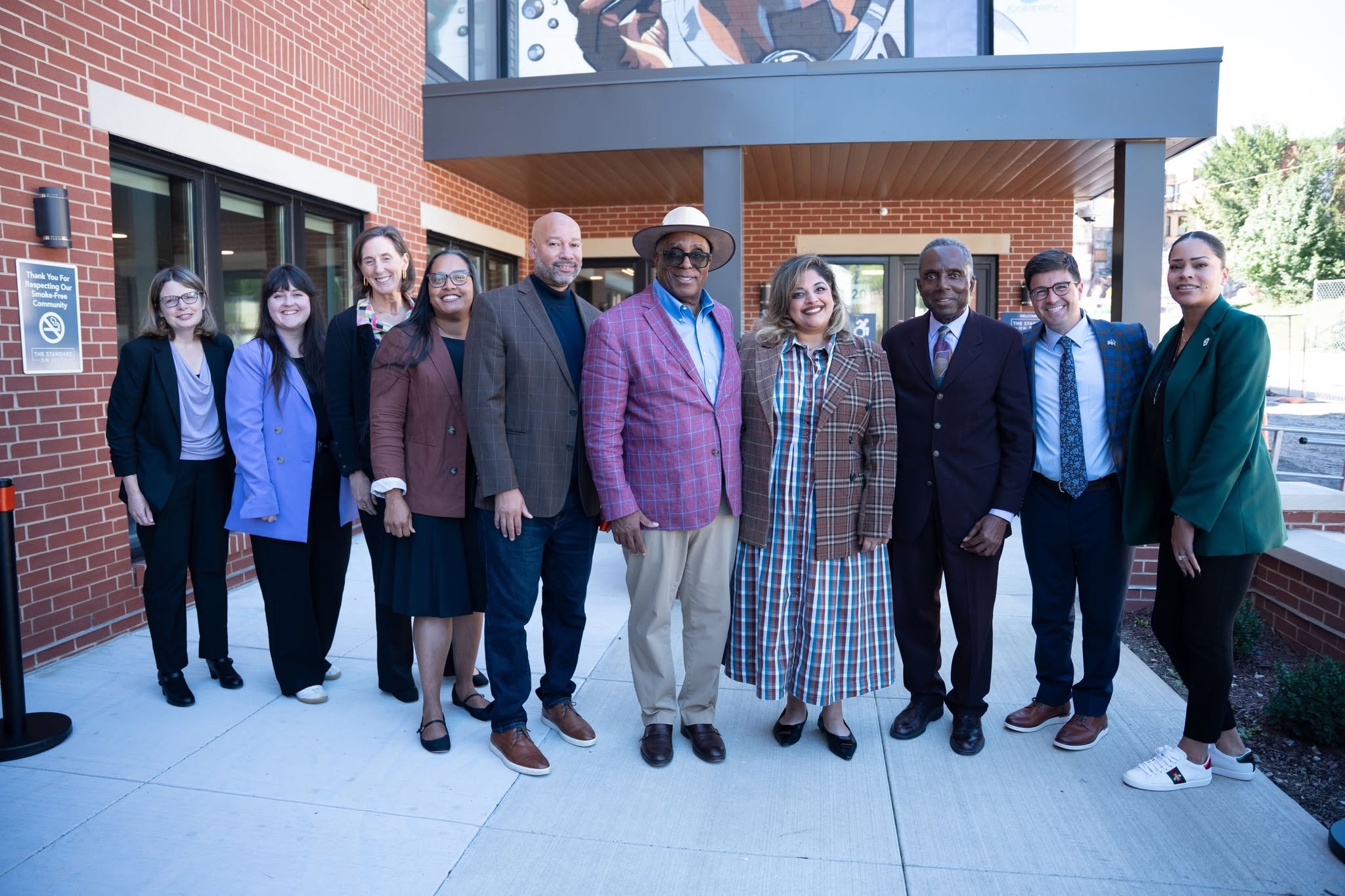 Ribbon-cutting ceremony group photo at The Standard on Fifth, including Beacon Communities leadership, elected officials and project partners